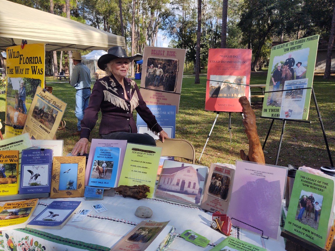 Author Nancy Dale, Ph.D. with Florida Cow Hunter History Books. [Courtesy photo]